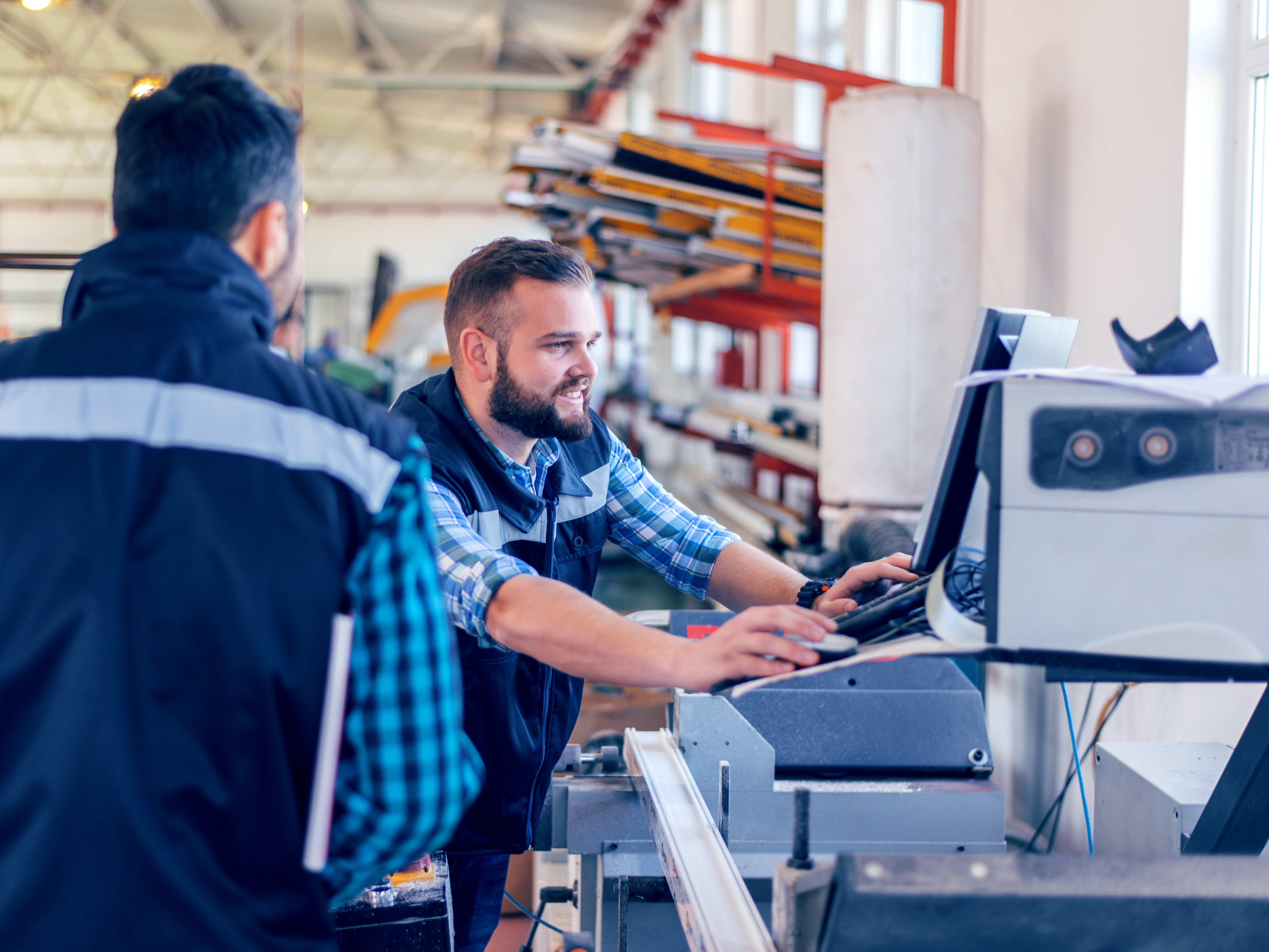 Two workers and a screen