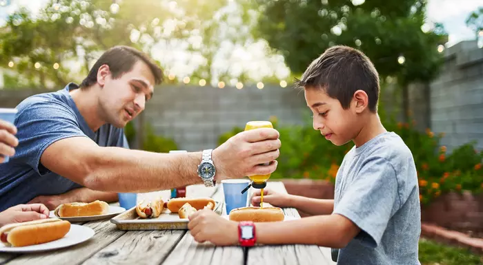 Boy BBQing with Father 